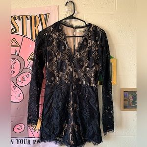 Black Lacy romper with a beige lining